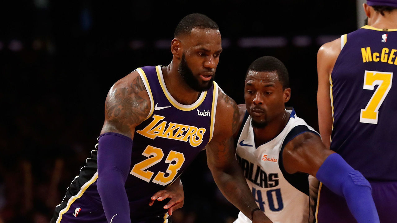 LOS ANGELES, CA - OCTOBER 31: LeBron James #2 dribbles off the screen of JaVale McGee #7 of the Los Angeles Lakers as Harrison Barnes #40 of the Dallas Mavericks defends during the second half of a game at Staples Center on October 31, 2018 in Los Angeles, California.