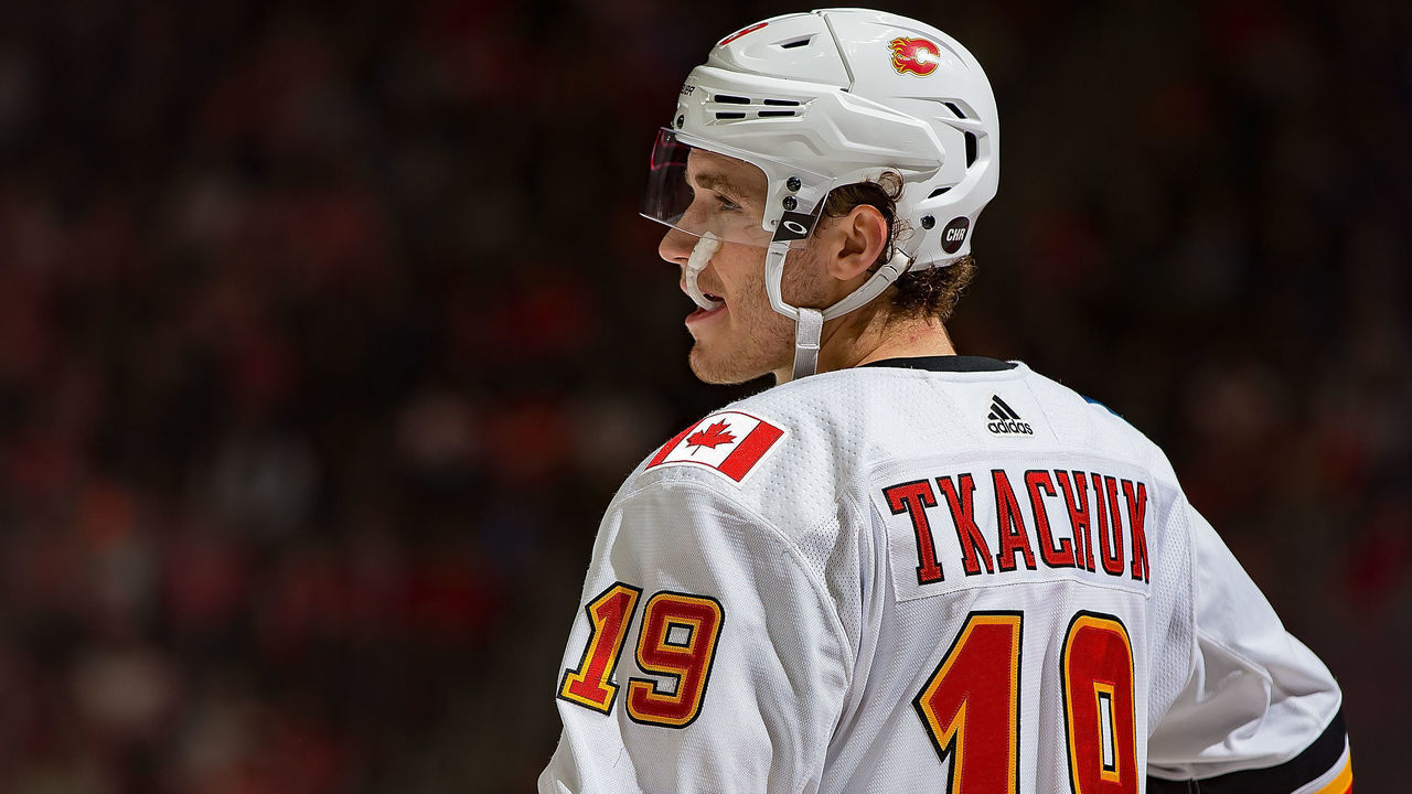 DETROIT, MI - JANUARY 02: Matthew Tkachuk #19 of the Calgary Flames gets set for the face-off during an NHL game against the Detroit Red Wings at Little Caesars Arena on January 2, 2019 in Detroit, Michigan. The Flames defeated the Red Wings 5-3.