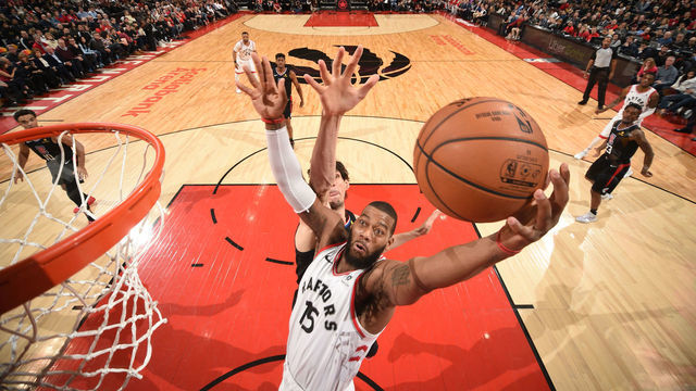 TORONTO, CANADA - FEBRUARY 3: Greg Monroe #15 of the Toronto Raptors goes up for contested dunk against the LA Clippers on February 3, 2019 at the Scotiabank Arena in Toronto, Ontario, Canada. Mandatory Copyright Notice: Copyright 2019 NBAE