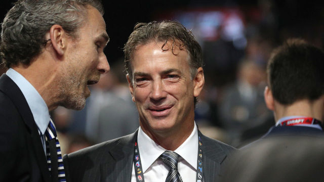 CHICAGO, IL - JUNE 24: General manager Joe Sakic of the Colorado Avalanche listens to president of hockey operations Trevor Linden of the Vancouver Canucks on the draft floor during the 2017 NHL Draft at United Center on June 24, 2017 in Chicago, Illinois.