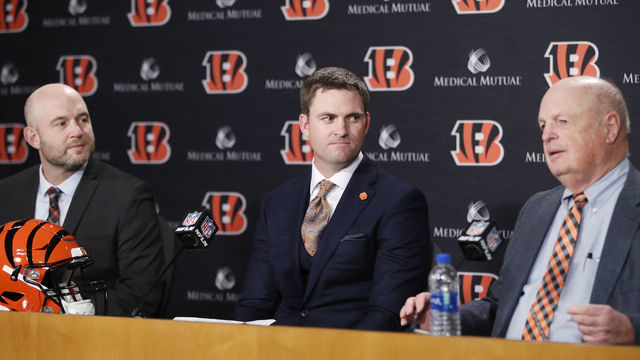CINCINNATI, OH - FEBRUARY 05: Zac Taylor speaks to the media as director of player personnel Duke Tobin (left) and owner Mike Brown (right) look on after being introduced as the new head coach for the Cincinnati Bengals at Paul Brown Stadium on February 5, 2019 in Cincinnati, Ohio.