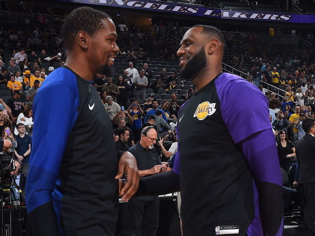 LAS VEGAS, NV- OCTOBER 10: Kevin Durant #35 of the Golden State Warriors and LeBron James #23 of the Los Angeles Lakers share a moment during a pre-season game on October 10, 2018 at T-Mobile Arena in Las Vegas, Nevada. NOTE TO USER: User expressly acknowledges and agrees that, by downloading and/or using this Photograph, user is consenting to the terms and conditions of the Getty Images License Agreement. Mandatory Copyright Notice: Copyright 2018 NBAE