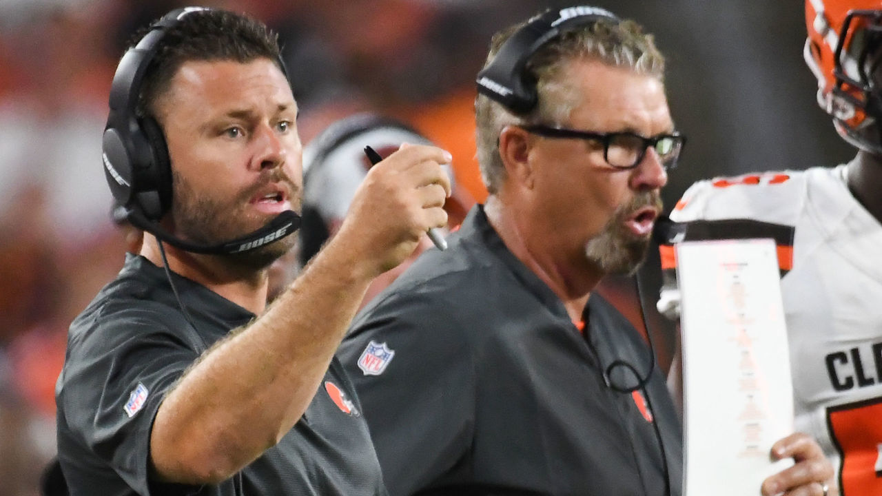 CLEVELAND, OH - AUGUST 17, 2018: Linebackers coach Blake Williams of the Cleveland Browns signals toward the defense as his father, defensive coordinator Gregg Williams, makes a call from the sideline in the second quarter of a preseason game against the Buffalo Bills at FirstEnergy Stadium in Cleveland, Ohio. Buffalo won 19-17. (Photo by: 2018 Nick Cammett/Diamond Images/Getty Images)