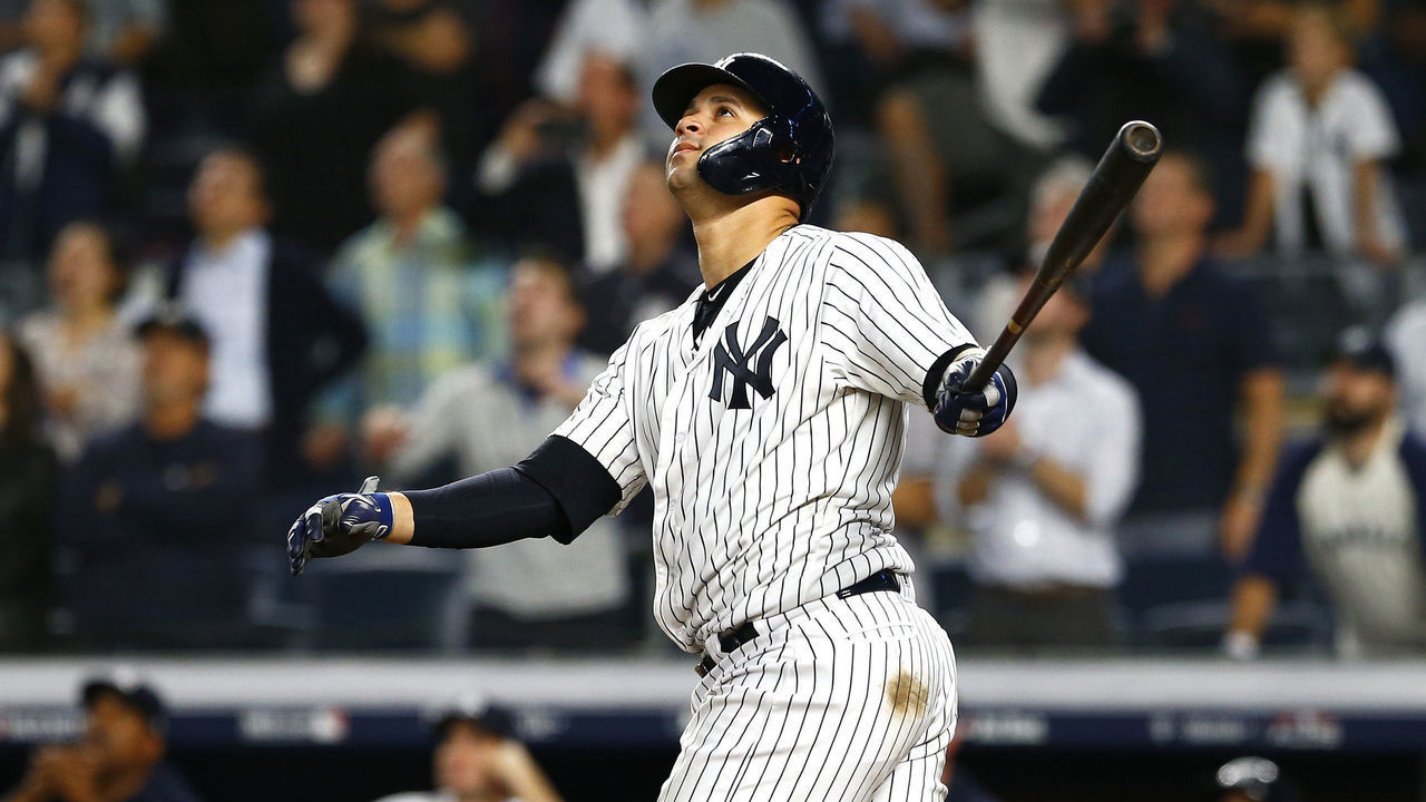 NEW YORK, NEW YORK - OCTOBER 09: Gary Sanchez #24 of the New York Yankees hits a sac fly to score Didi Gregorius #18 against Craig Kimbrel #46 of the Boston Red Sox during the ninth inning in Game Four of the American League Division Series at Yankee Stadium on October 09, 2018 in the Bronx borough of New York City.