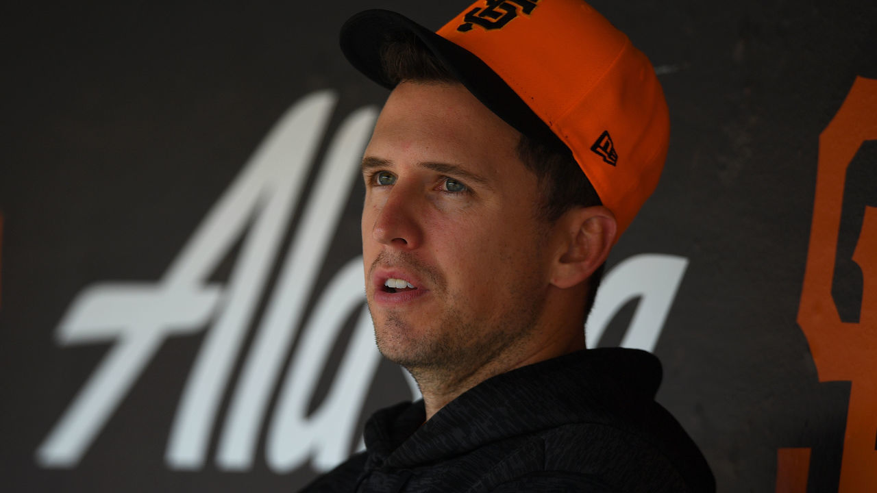 SAN FRANCISCO, CA - AUGUST 25: Buster Posey #28 of the San Francisco Giants looks on from the dugout against the Texas Rangers in the top of the third inning at AT&T Park on August 25, 2018 in San Francisco, California.