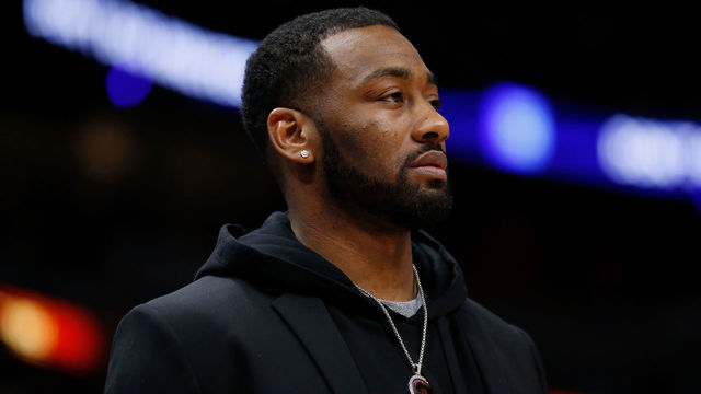 MIAMI, FL - JANUARY 04: John Wall #2 of the Washington Wizards looks on from the bench against the Miami Heat at American Airlines Arena on January 4, 2019 in Miami, Florida.