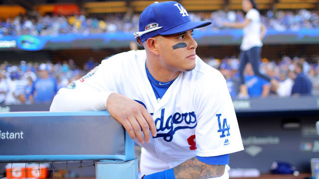 LOS ANGELES, CA - OCTOBER 15: Manny Machado #8 of the Los Angeles Dodgers is seen in the dugout before Game 3 of the NLCS against the Milwaukee Brewers at Dodger Stadium on Monday, October 15, 2018 in Los Angeles, California.