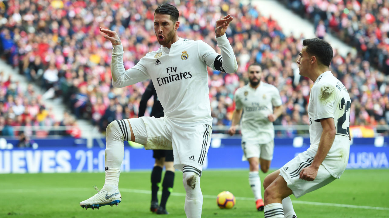 MADRID, SPAIN - FEBRUARY 09: Sergio Ramos of Real Madrid celebrates after scoring his team's second goal from a penalty with Sergio Reguilon during the La Liga match between Club Atletico de Madrid and Real Madrid CF at Wanda Metropolitano on February 09, 2019 in Madrid, Spain.
