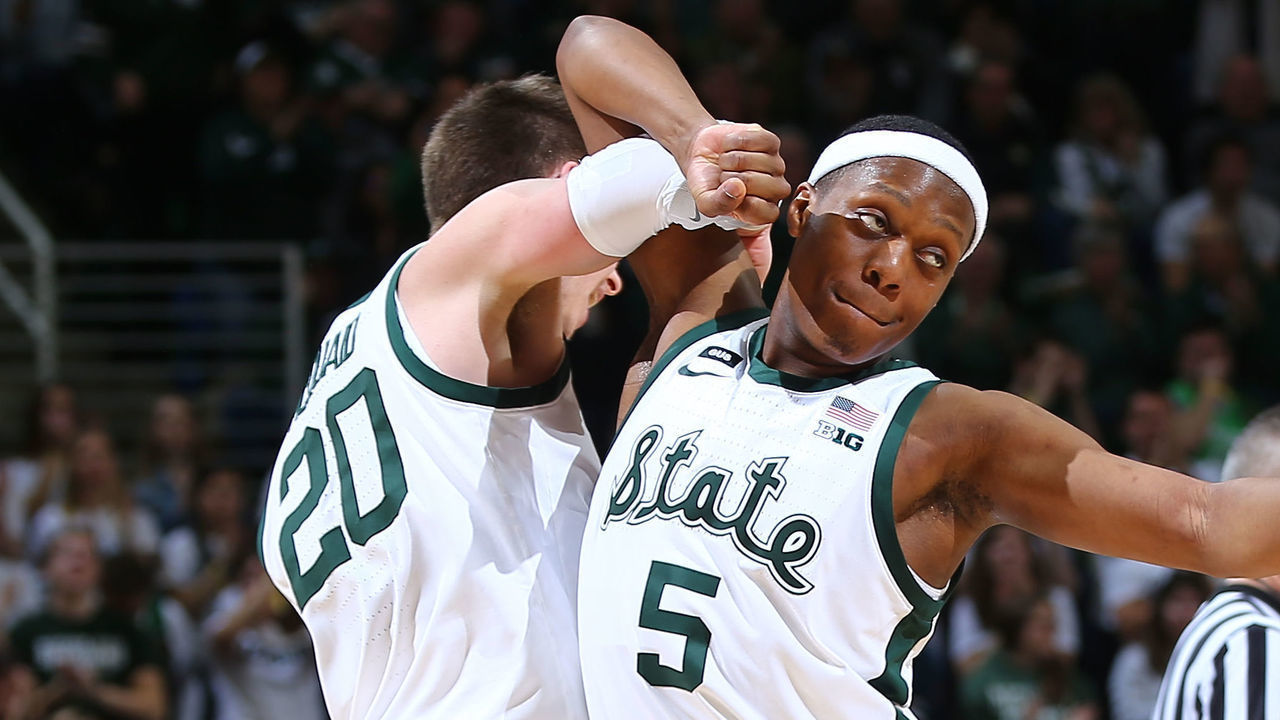 EAST LANSING, MI - FEBRUARY 09: Matt McQuaid #20 of the Michigan State Spartans celebrates his made basket with Cassius Winston #5 of the Michigan State Spartans in the second half at Breslin Center on February 9, 2019 in East Lansing, Michigan.