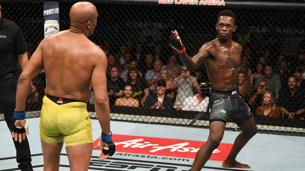 MELBOURNE, AUSTRALIA - FEBRUARY 10: (R-L) Israel Adesanya of New Zealand taunts Anderson Silva of Brazil in their middleweight bout during the UFC 234 at Rod Laver Arena on February 10, 2019 in the Melbourne, Australia.