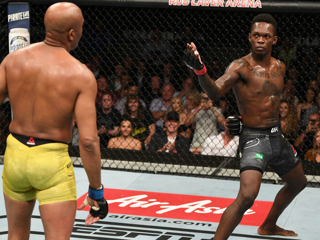 MELBOURNE, AUSTRALIA - FEBRUARY 10: (R-L) Israel Adesanya of New Zealand taunts Anderson Silva of Brazil in their middleweight bout during the UFC 234 at Rod Laver Arena on February 10, 2019 in the Melbourne, Australia.