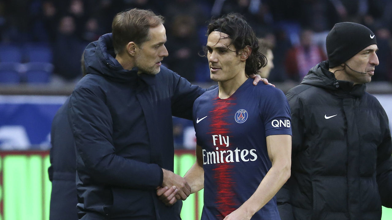 PARIS, FRANCE - FEBRUARY 9 : Injured while scoring his goal on a penalty kick, Edinson Cavani of PSG talks to coach of PSG Thomas Tuchel while leaving the pitch during the french Ligue 1 match between Paris Saint-Germain (PSG) and Girondins de Bordeaux at Parc des Princes on February 9, 2019 in Paris, France.