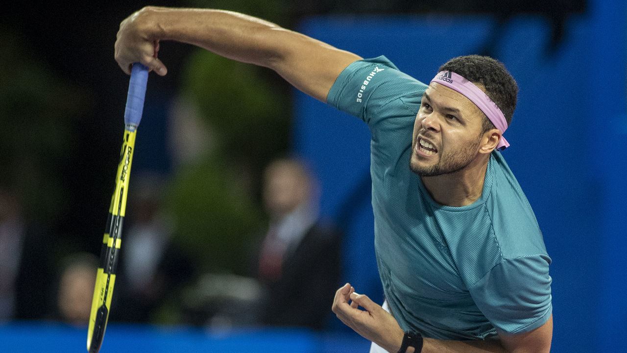 MONTPELLIER, FRANCE - February 10 Jo-Wilfried Tsonga of France in action against Pierre-Hughes Herbert of France in the Men's Final match during the Open Sud de France Tennis Tournament at the Sud de France Arena on February 10th 2019, Montpellier, France
