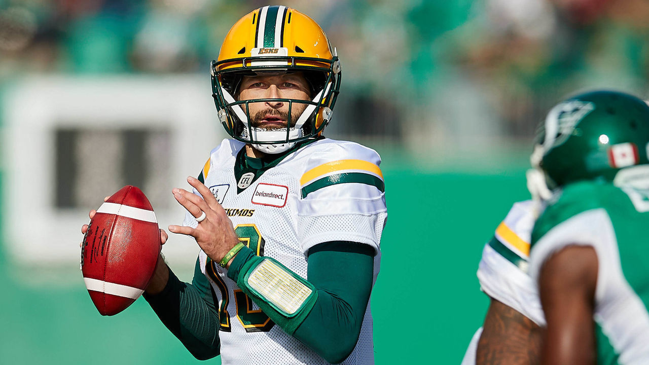 REGINA, SK - OCTOBER 08: Mike Reilly #13 of the Edmonton Eskimos looks for an open receiver in the first half of the game between the Edmonton Eskimos and Saskatchewan Roughriders at Mosaic Stadium on October 8, 2018 in Regina, Canada.