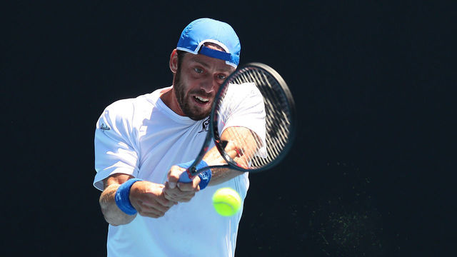 MELBOURNE, AUSTRALIA - JANUARY 11: Paolo Lorenzi of Italy plays a backhand in his match against Daniel Evans of Great Britain during Qualifying ahead of the 2019 Australian Open at Melbourne Park on January 11, 2019 in Melbourne, Australia.