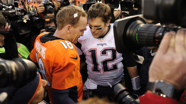 DENVER, CO - JANUARY 24: Peyton Manning (18) of the Denver Broncos and Tom Brady (12) of the New England Patriots meet on the field after the game. The Denver Broncos played the New England Patriots in the AFC championship game at Sports Authority Field at Mile High in Denver, CO on January 24, 2016.