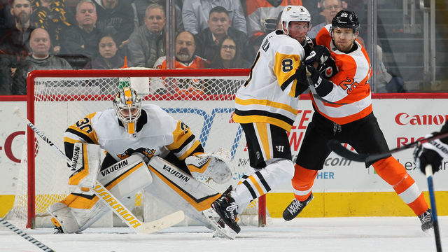 PHILADELPHIA, PA - FEBRUARY 11: Goaltender Matt Murray #30 of the Pittsburgh Penguins keeps his eyes on the loose puck as Brian Dumoulin #8 defends against James van Riemsdyk #25 of the Philadelphia Flyers on February 11, 2019 at the Wells Fargo Center in Philadelphia, Pennsylvania.