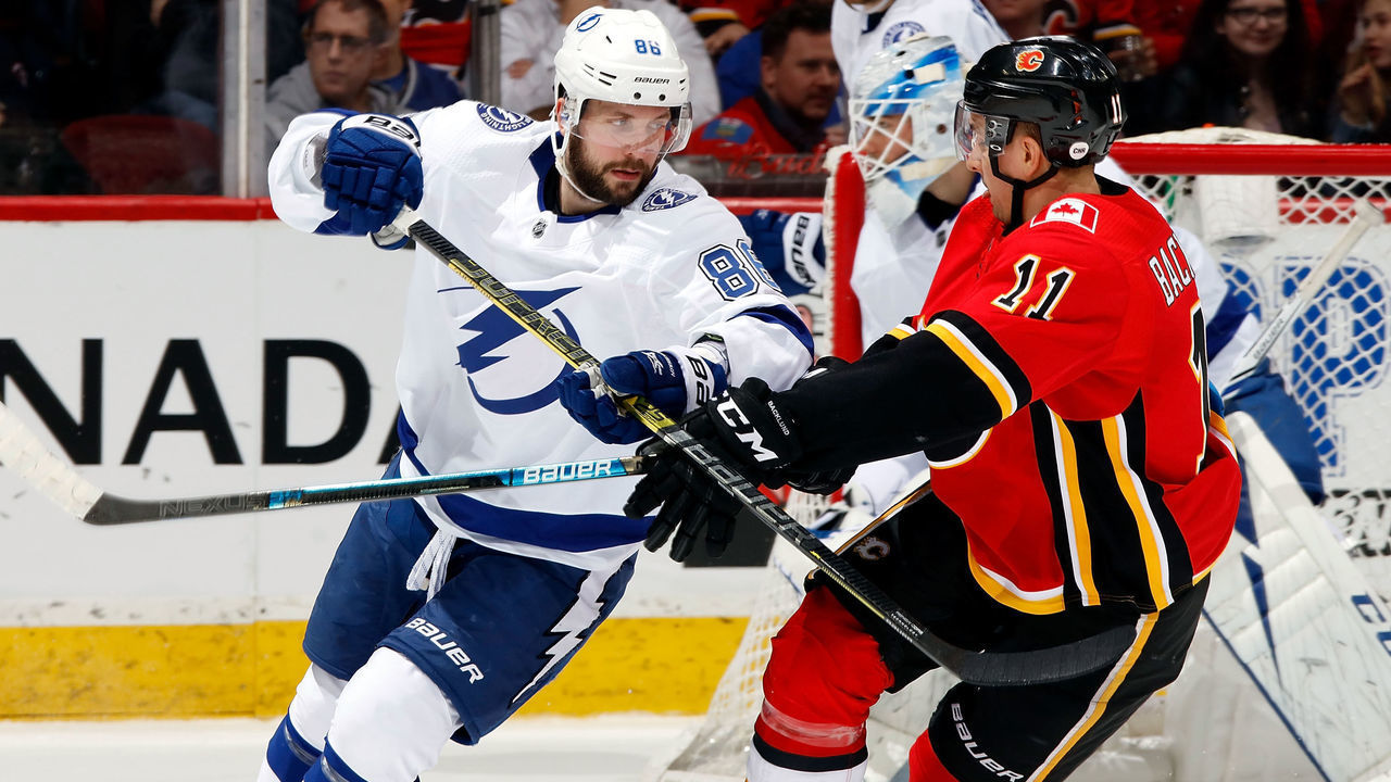 CALGARY, AB - DECEMBER 20: Nikita Kucherov #86 of the Tampa Bay Lightning and Mikael Backlund #11 of the Calgary Flames skate during an NHL game on December 20, 2018 at the Scotiabank Saddledome in Calgary, Alberta, Canada.
