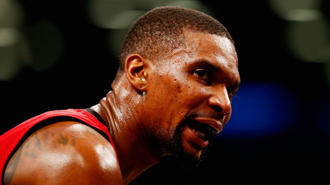 NEW YORK, NY - JANUARY 26: Chris Bosh #1 of the Miami Heat looks on against the Brooklyn Nets during their game at the Barclays Center on January 26, 2016 in New York City. NOTE TO USER: User expressly acknowledges and agrees that, by downloading and/or using this Photograph, user is consenting to the terms and conditions of the Getty Images License Agreement.