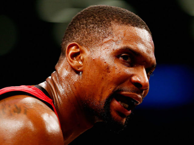 NEW YORK, NY - JANUARY 26: Chris Bosh #1 of the Miami Heat looks on against the Brooklyn Nets during their game at the Barclays Center on January 26, 2016 in New York City. NOTE TO USER: User expressly acknowledges and agrees that, by downloading and/or using this Photograph, user is consenting to the terms and conditions of the Getty Images License Agreement.