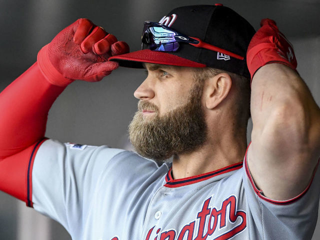 DENVER, CO - SEPTEMBER 30: Washington Nationals right fielder Bryce Harper (34) adjusts his hat before taking the field during the final regular season game of the 2018 season against the Colorado Rockies at Coors Field.