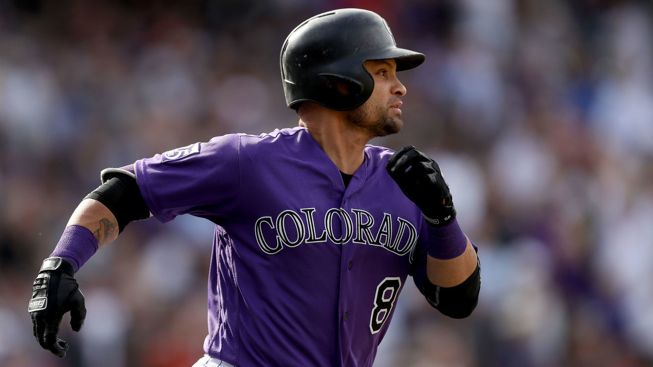 DENVER, CO - SEPTEMBER 27: Gerardo Parra #8 of the Colorado Rockies runs down the baseline after hitting a home runin the seventh inning against the Philadelphia Phillies at Coors Field on September 27, 2018 in Denver, Colorado.