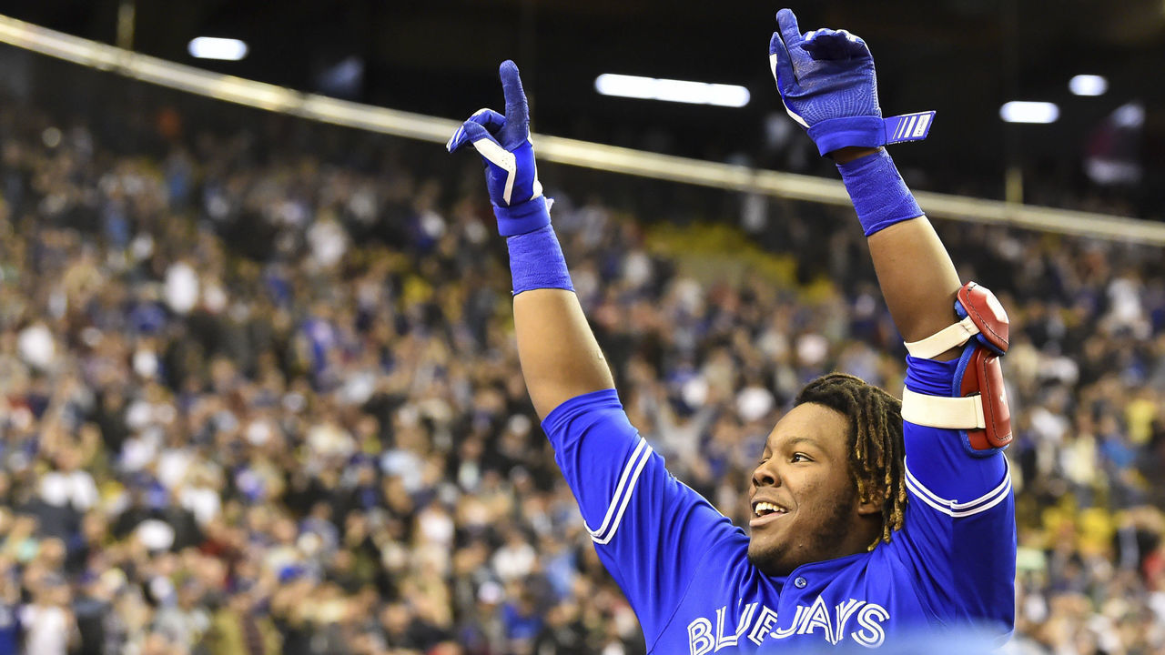 MONTREAL, QC - MARCH 27: Vladimir Guerrero Jr. #27 of the Toronto Blue Jays acknowledges the fans after hitting a home run in the bottom of the ninth against the St. Louis Cardinals during the MLB preseason game at Olympic Stadium on March 27, 2018 in Montreal, Quebec, Canada. The Toronto Blue Jays defeated the St. Louis Cardinals 1-0.