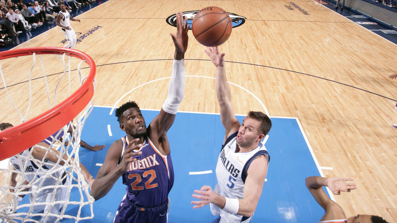 DALLAS, TX - JANUARY 9: Deandre Ayton #22 of the Phoenix Suns blocks a shot against J.J. Barea #5 of the Dallas Mavericks on January 9, 2019 at the American Airlines Center in Dallas, Texas. Mandatory Copyright Notice: Copyright 2019 NBAE