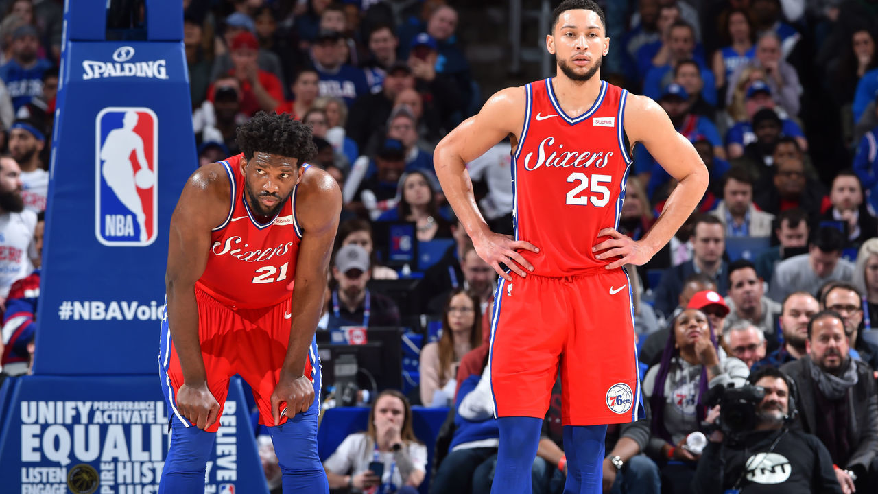 PHILADELPHIA, PA - FEBRUARY 12: Joel Embiid #21, and Ben Simmons #25 of the Philadelphia 76ers looks on against the Boston Celtics on February 12, 2019 at the Wells Fargo Center in Philadelphia, Pennsylvania NOTE TO USER: User expressly acknowledges and agrees that, by downloading and/or using this Photograph, user is consenting to the terms and conditions of the Getty Images License Agreement. Mandatory Copyright Notice: Copyright 2019 NBAE
