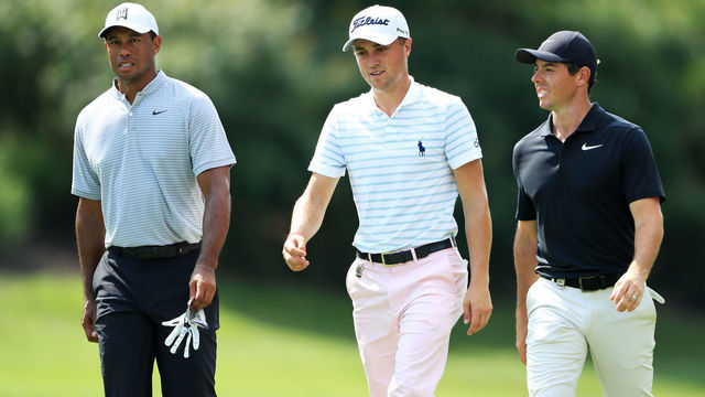 ST LOUIS, MO - AUGUST 10: (L-R) Tiger Woods of the United States, Justin Thomas of the United States and Rory McIlroy of Northern Ireland walk on the eighth hole during the second round of the 2018 PGA Championship at Bellerive Country Club on August 10, 2018 in St Louis, Missouri.