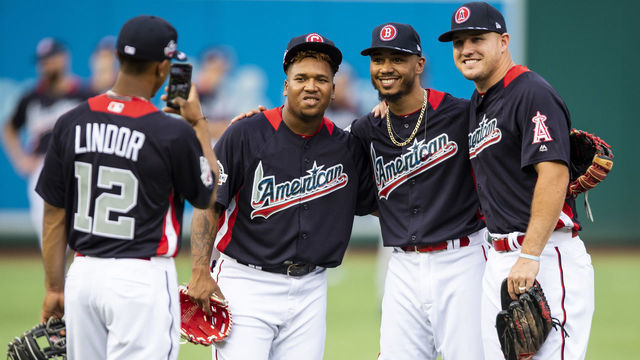 WASHINGTON, DC - JULY 16: Francisco Lindor #12 of the Cleveland Indians takes a photograph of Jose Ramirez #11 of the Cleveland Indians, Mookie Betts #50 of the Boston Red Sox, and Mike Trout #27 of the Los Angeles Angels of Anaheim during All-Star Workout Day at Nationals Park Monday, July 16, 2018 in Washington, DC.