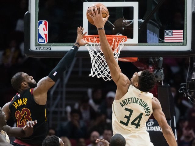 CLEVELAND, OH - MARCH 19: Giannis Antetokounmpo #34 of the Milwaukee Bucks dunks over LeBron James #23 of the Cleveland Cavaliers during the second half at Quicken Loans Arena on March 19, 2018 in Cleveland, Ohio. The Cavaliers defeated the Bucks 124-117.