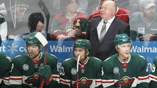 ST. PAUL, MN - DECEMBER 22: Bruce Boudreau of the Minnesota Wild looks out from the bench behind Marcus Foligno #17 of the Minnesota Wild, J.T. Brown #23 of the Minnesota Wild and Charlie Coyle #3 of the Minnesota Wild during a game with the Dallas Stars at Xcel Energy Center on December 22, 2018 in St. Paul, Minnesota.