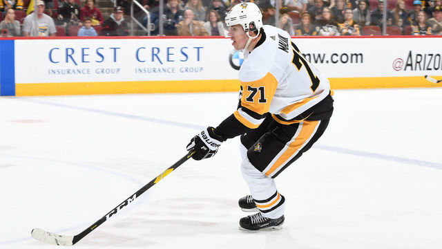 GLENDALE, AZ - JANUARY 18: Evgeni Malkin #71 of the Pittsburgh Penguins skates with the puck against the Arizona Coyotes at Gila River Arena on January 18, 2019 in Glendale, Arizona.