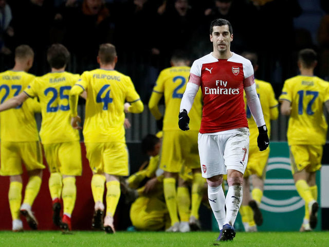 BARYSAW, BELARUS - FEBRUARY 14: Henrikh Mkhitaryan of Arsenal reacts as BATE Borisov players celebrate a goal in background during the UEFA Europa League Round of 32 First Leg match between BATE Borisov and Arsenal at Borisov-Arena on February 14, 2019 in Borisov, Belarus.