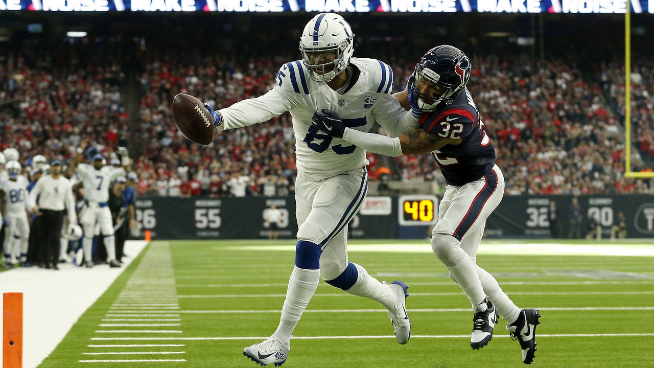 HOUSTON, TX - JANUARY 05: Eric Ebron #85 of the Indianapolis Colts catches a pass for a touchdown defended by Tyrann Mathieu #32 of the Houston Texans in the first quarter during the Wild Card Round at NRG Stadium on January 5, 2019 in Houston, Texas.