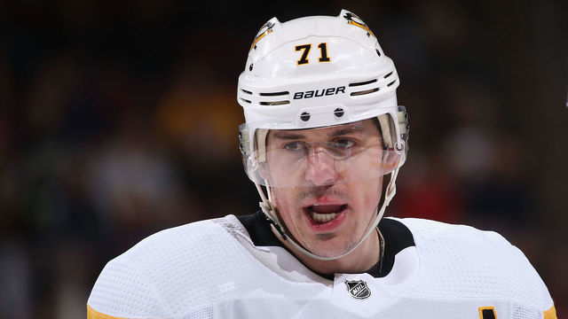 GLENDALE, ARIZONA - JANUARY 18: Evgeni Malkin #71 and Brian Dumoulin #8 of the Pittsburgh Penguins talk during the third period of the NHL game against the Arizona Coyotes at Gila River Arena on January 18, 2019 in Glendale, Arizona. The Penguins defeated the Coyotes 3-2 in overtime.