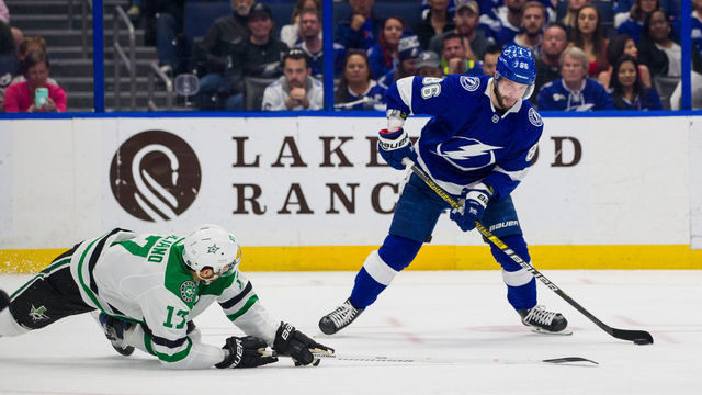 TAMPA, FL - FEBRUARY 14: Nikita Kucherov #86 of the Tampa Bay Lightning skates against Andrew Cogliano #17 of the Dallas Stars in the second period at Amalie Arena on February 14, 2019 in Tampa, Florida.