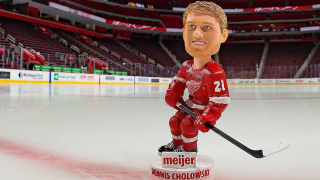 DETROIT, MI - FEBRUARY 14: Fan that arrive early will get a Dennis Cholowski #21 of the Detroit Red Wings bobble head prior to an NHL game against the Ottawa Senators at Little Caesars Arena on February 14, 2019 in Detroit, Michigan.