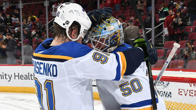 GLENDALE, AZ - FEBRUARY 14: Goalie Jordan Binnington #50 of the St Louis Blues is congratulated by teammate Vladimir Tarasenko #91 after a 4-0 shutout victory against the Arizona Coyotes at Gila River Arena on February 14, 2019 in Glendale, Arizona. Tarasenko had two goals in the victory.