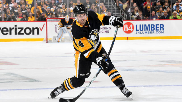 PITTSBURGH, PA - OCTOBER 06: Justin Schultz #4 of the Pittsburgh Penguins takes a shot against the Montreal Canadiens at PPG Paints Arena on October 6, 2018 in Pittsburgh, Pennsylvania.