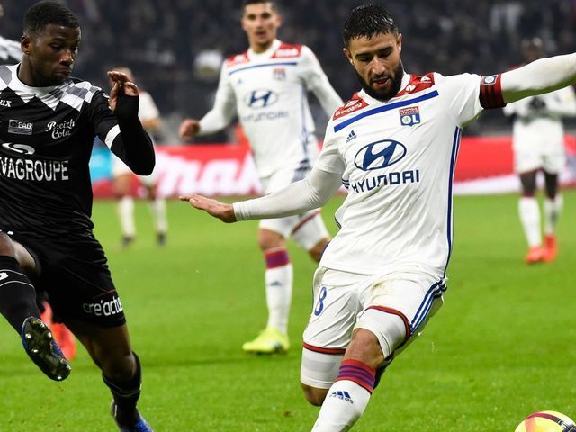 Guingamp's French defender Cheik Traore (L) vies ofr the ball with Lyon's French forward Nabil Fekir during the French L1 football match between Lyon (OL) and Guingamp (EAG) on February 15, 2019, at the Groupama Stadium in Decines-Charpieu, near Lyon, central-eastern France.