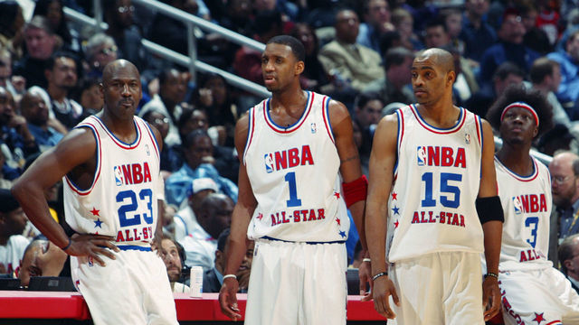 ATLANTA - FEBRUARY 9: (L-R) Michael Jordan (Washington Wizards) #23, Tracy McGrady (Orlando Magic) #1, Vince Carter (Toronto Raptors) #15, Ben Wallace (Detroit Pistons) #3 and Jermaine O'Neal (Indiana Pacers) #7 of the Eastern Conference All-Stars look on at the 2003 NBA All-Star Game on February 9, 2003 at Philips Arena in Atlanta, Georgia. NOTE TO USER: User expressly acknowledges and agrees that, by downloading and or using this photograph, user is consenting to the terms and conditions of the Getty Images license agreement.