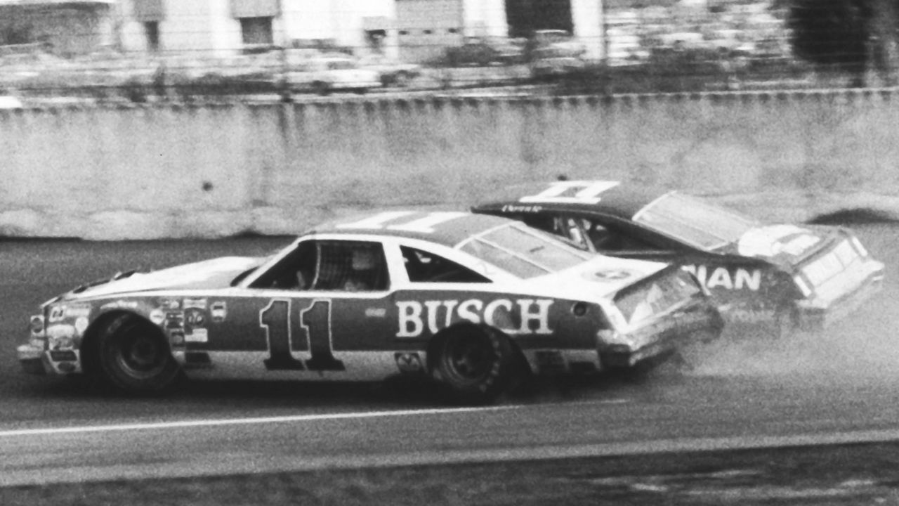 DAYTONA BEACH, FL - FEBRUARY 18, 1979: Cale Yarborough (No. 11) and Donnie Allison (No. 1) crash into each other while battling for the lead on the next-to-last lap of the Daytona 500 NASCAR Cup race at Daytona International Speedway. The incident led to the now-famous fight that also involved DonnieÕs brother Bobby Allison in front of a live CBS television audience. It also allowed Richard Petty to claim his sixth Daytona 500 victory and break a 45-race winless streak.