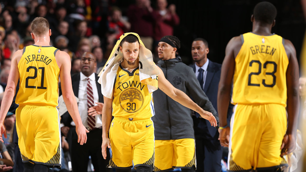 PORTLAND, OR - FEBRUARY 13: Stephen Curry #30 of the Golden State Warriors high fives his teammates during the game against the Portland Trail Blazers on February 13, 2019 at the Moda Center in Portland, Oregon. NOTE TO USER: User expressly acknowledges and agrees that, by downloading and/or using this photograph, user is consenting to the terms and conditions of the Getty Images License Agreement. Mandatory Copyright Notice: Copyright 2019 NBAE
