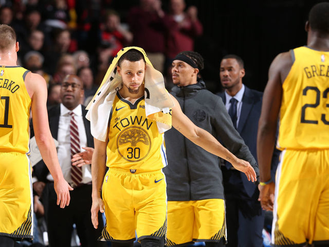 PORTLAND, OR - FEBRUARY 13: Stephen Curry #30 of the Golden State Warriors high fives his teammates during the game against the Portland Trail Blazers on February 13, 2019 at the Moda Center in Portland, Oregon. NOTE TO USER: User expressly acknowledges and agrees that, by downloading and/or using this photograph, user is consenting to the terms and conditions of the Getty Images License Agreement. Mandatory Copyright Notice: Copyright 2019 NBAE