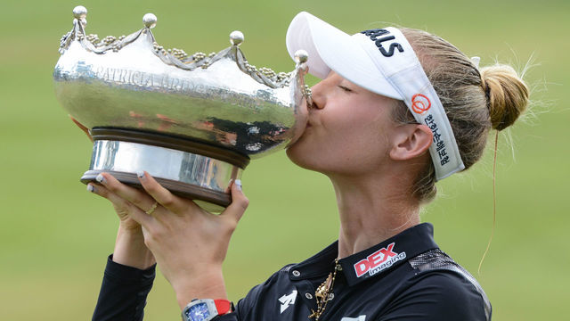 Nelly Korda of the US kisses the winner's trophy following her victory on the final day of the women's LPGA Tour-sanctioned Australian Open golf championship at the Grange Golf Club in Adelaide on February 17, 2019.