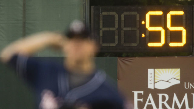 PORTLAND, ME - AUGUST 23: With the pitchers warm up clock running in the background, a New Hampshire Fisher Cats pitcher warms up during AA baseball action against the Portland Sea Dogs at Hadlock Field in Portland on August 23, 2016.