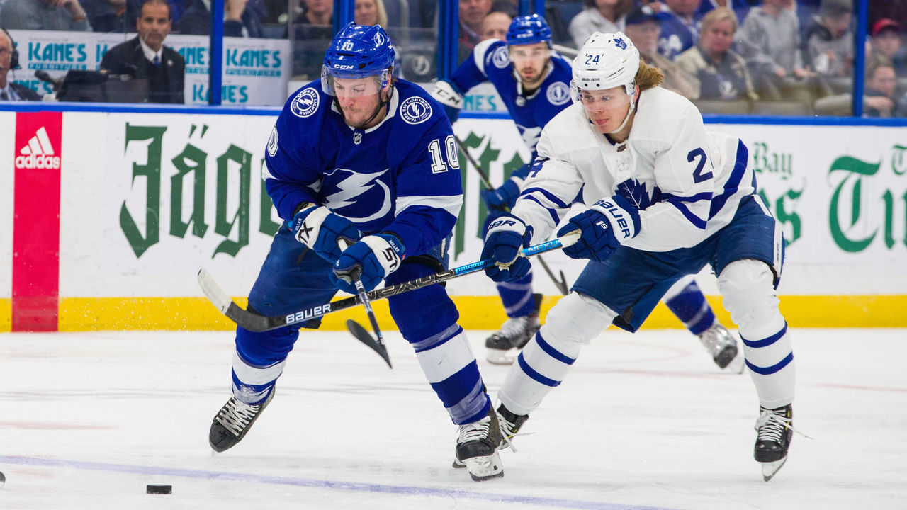 TAMPA, FL - JANUARY 17: J.T. Miller #10 of the Tampa Bay Lightning skates against Kasperi Kapanen #24 of the Toronto Maple Leafs during the third period at Amalie Arena on January 17, 2019 in Tampa, Florida.