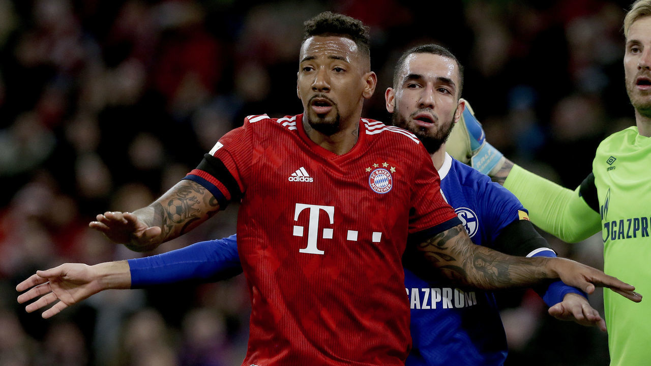 MUNICH, GERMANY - FEBRUARY 9: (L-R) Nabil Bentaleb of Schalke 04, Jerome Boateng of Bayern Munchen during the German Bundesliga match between Bayern Munchen v Schalke 04 at the Allianz Arena on February 9, 2019 in Munich Germany